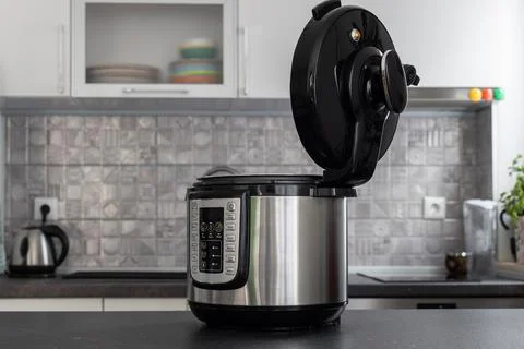 Modern multi cooker in kitchen. Open, ready to cook. Stock-Fotos