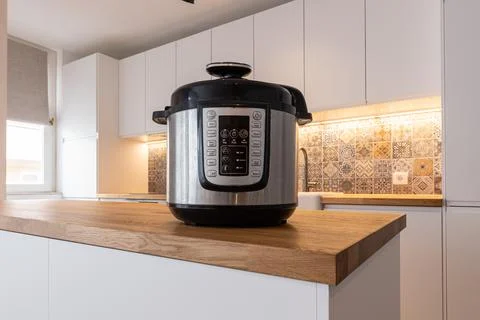 Modern multi cooker in kitchen Stock Photos