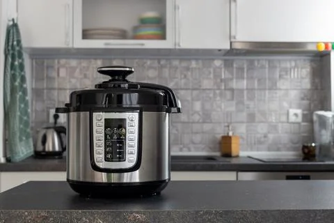 Modern multi cooker in the kitchen Stock Photos
