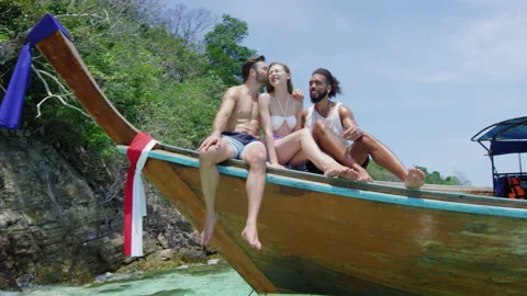 Modern multi ethnic friends hanging out, portrait of them smiling, sitting on lo Video stock 201093987