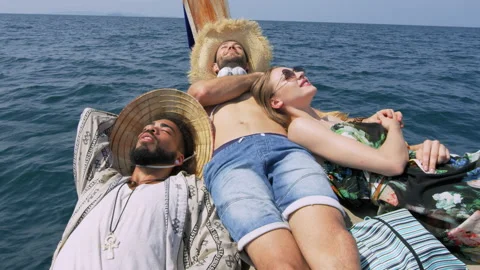 Modern multi ethnic friends hanging out and chilling wile traveling on long tail Stock Footage 201094068