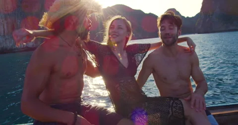 Modern multi ethnic friends hanging out and traveling on long tail boat tour in Stock-Footage 201095129