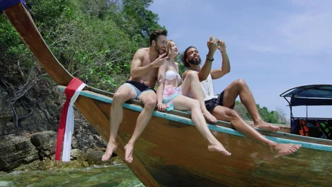 Modern multi ethnic friends taking photo or video with smartphone, sitting on si Stock Footage 201094901
