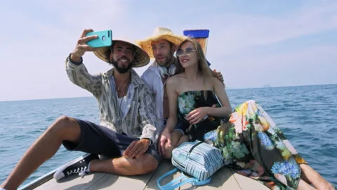 Modern multi ethnic friends taking photo or video with smartphone on long tail b Stock Footage 201095044