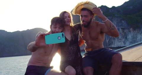 Modern multi ethnic friends taking photo or video with smartphone on long tail b Stock-Footage 201096118