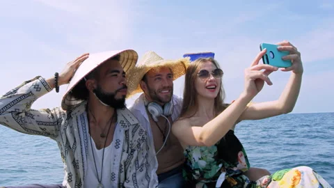 Modern multi ethnic friends taking photo or video with smartphone on long tail b Stock Footage 201096958