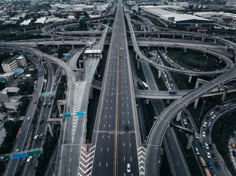 Modern Multi Level Highway Interchange With Heavy Traffic Flow In Samut Pra.. Stock Photos