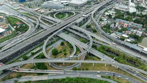 Modern Multi-level Highway Interchange Infrastructure Connecting Urban Dist.. Stock Photos