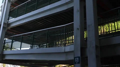 Modern Multi-Level Parking Structure Facade with Greenery Stock Footage 264958736