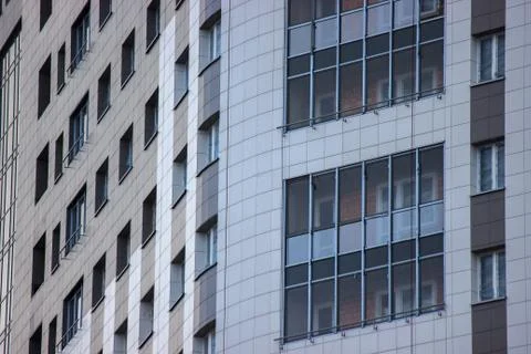Modern multi-storey building, skyscraper. construction of a glass house. a la Stock Photos