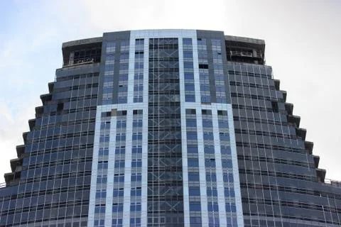 Modern multi-storey building, skyscraper. construction of a glass house. a la Stock Photos