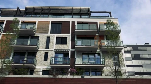 Modern multi-storey house with windows and balconies Stock Footage 65993935