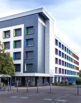 Modern multi story building with creative architecture and vibrant colorful.. Stock Photos