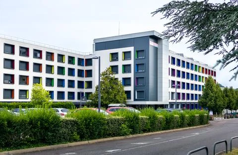 Modern multi story building with creative architecture and vibrant colorful.. Stock Photos