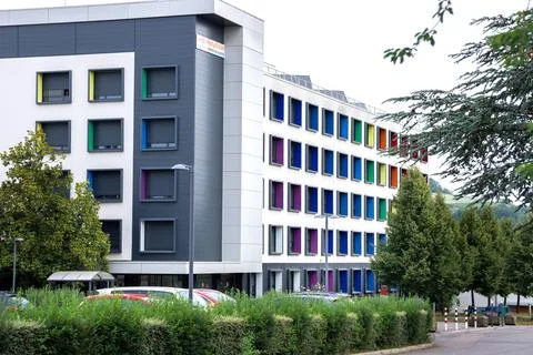 Modern multi story building with creative architecture and vibrant colorful.. Stock Photos