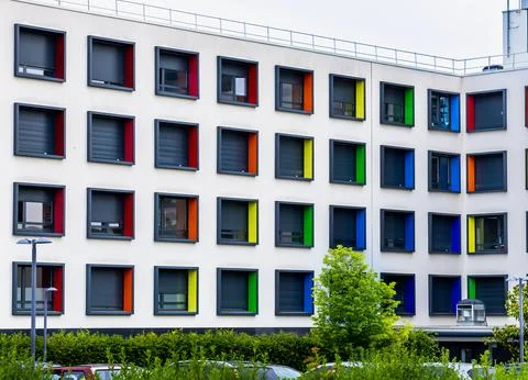 Modern multi story building with creative architecture and vibrant colorful.. Stock Photos