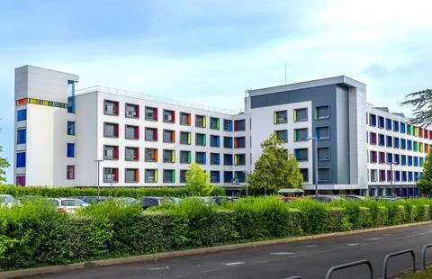 Modern multi story building with creative architecture and vibrant colorful.. Stock Photos