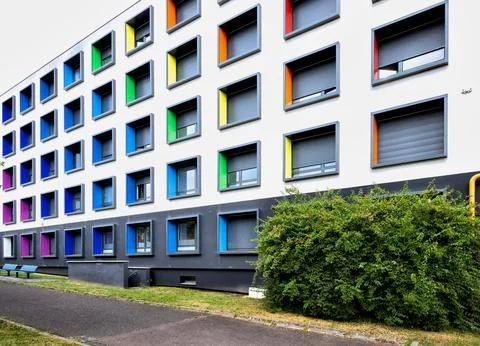 Modern multi story building with creative architecture and vibrant colorful.. Stock Photos