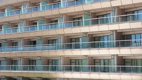 Modern Multi-Story Building Facade with Repeating Geometric Design Stock Footage 339102141