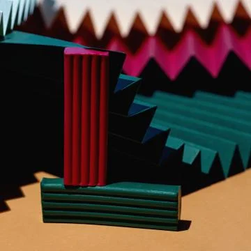 Modern multicolored composition of bars of clay and fans of cardboard. Stylish Photos