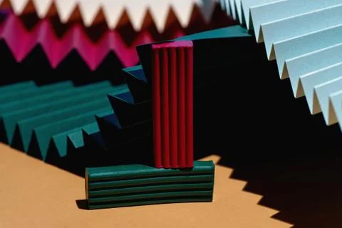 Modern multicolored composition of bars of clay and fans of cardboard. Stylish Stockfoto's