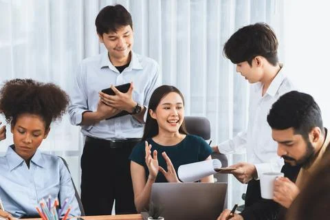 Modern multicultural office worker in corporate workplace. Concord Stock Photos