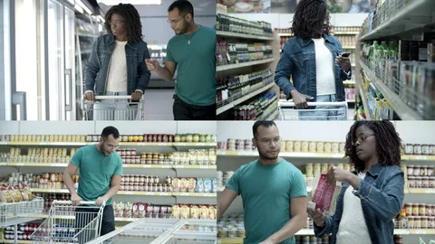 Modern multiethnic couple buying food in supermarket Stock Footage 130017543