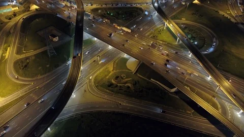 Modern multilevel road junction night high-speed traffic jam Megalopolis Aerial Video stock 116267912