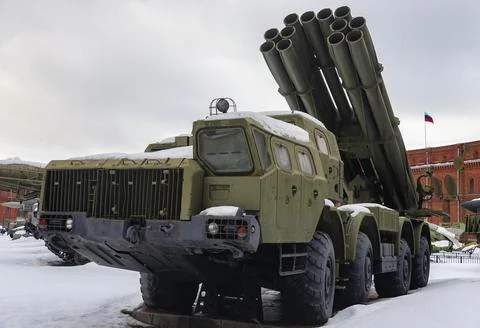 Modern multiple rocket launcher system in the parking lot in winter. Stock Photos
