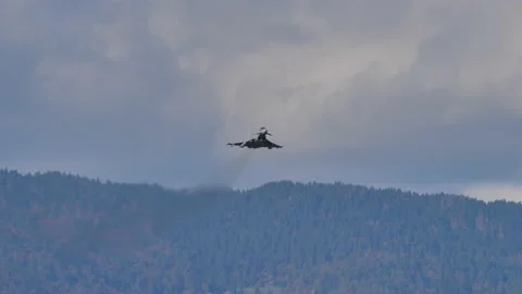 Modern multirole fighter jet makes high performance turn in blue cloudy sky Video stock 168015054