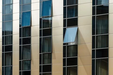Modern new building with open window, urban architectural pattern Stock Photos