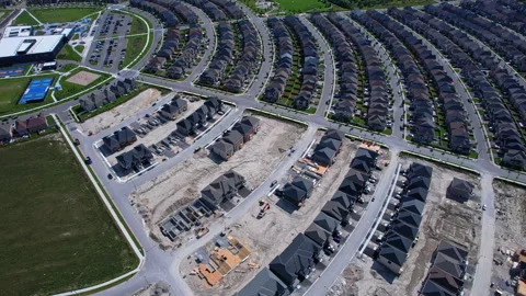Modern North American homes in construction near live in community. Aerial .. Stock Footage 346728565