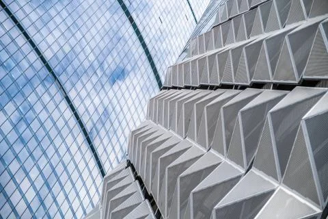 Modern office building with angular / rhombus structure of cells. Reworked Stock Photos