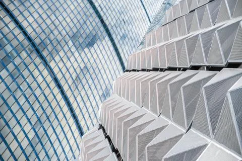 Modern office building with angular / rhombus structure of cells. Reworked Stock Photos