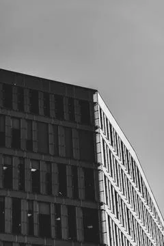 Modern Office Building Facade in Dramatic Black and White Contrast Stock Photos