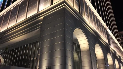 Modern Office Building Facade with Luxury Architectural Lighting at Night Stock Footage 334313385