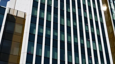 Modern office building facade with white vertical pillars and glass Stock Footage 331582299