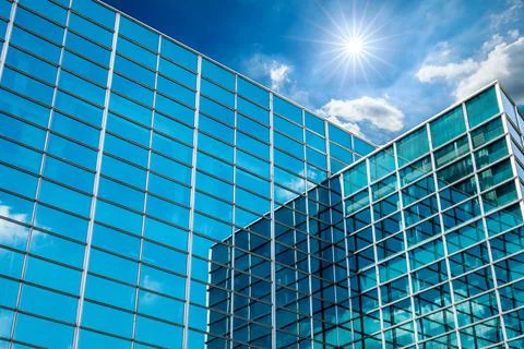 Modern office building with glass facade on a clear sky background. Fotos de archivo