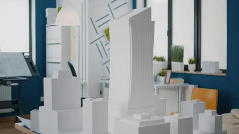 Modern office building model in workspace Stock Photos
