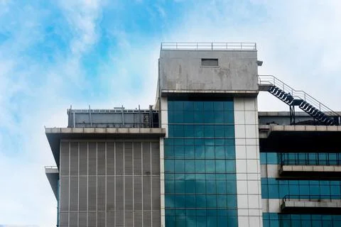 Modern office building on sky background Stock Photos