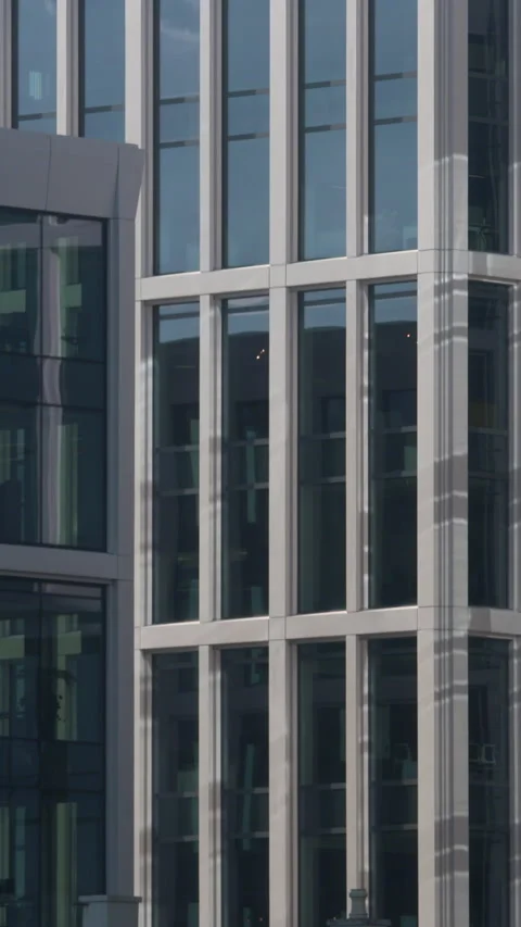 Modern office building tall windows symmetrical vertical pattern Stock Footage 341771875