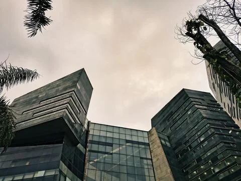 Modern Office Buildings with Dramatic Sky and Urban Architecture Stock Photos