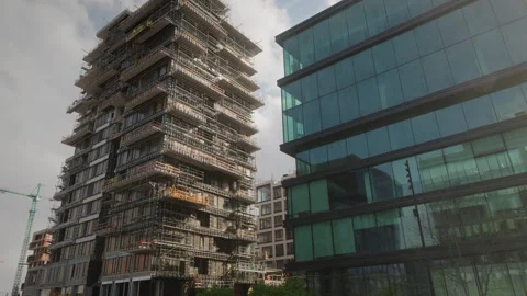 Modern office buildings under constructon, finished glass office near Stock Footage 258283410