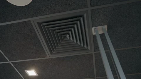 Modern Office Ceiling: Acoustic Tiles, LED Lights, and HVAC Vent Stock Footage 346045116