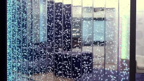 Modern office design features a sophisticated water element that enhances 動画素材 283363569