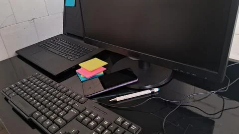 Modern office desk with computer and laptop. Professional workspace with tech Foto stock