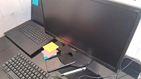 Modern office desk with computer setup. Professional workspace with laptop and Stock Photos