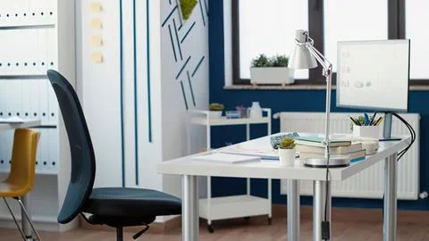 Modern office desk with computer setup Stock Photos