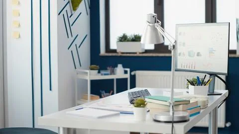 Modern office desk with computer setup Stock Photos