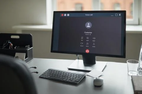 Modern Office Desk Featuring Computer Monitor Displaying Video Call Interface Stock Photos